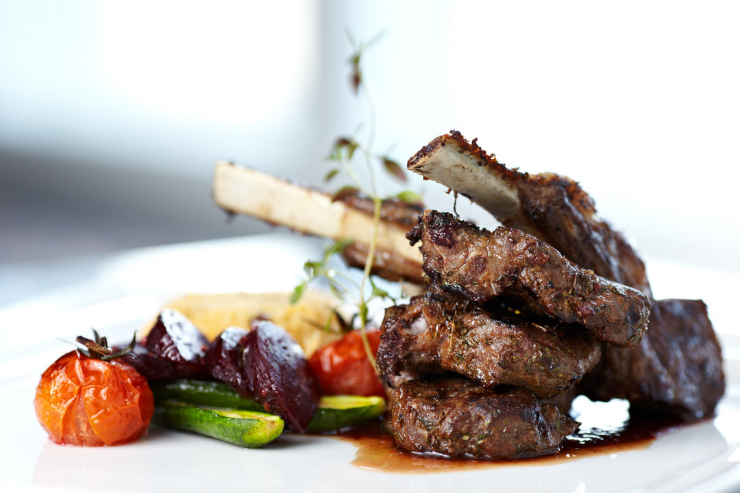 Roasted Lamb Rack with Velvet Black Olive Sauce