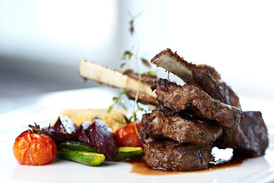 Roasted Lamb Rack with Velvet Black Olive Sauce